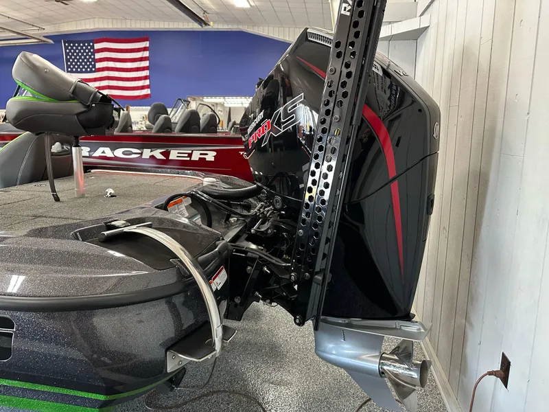 Slide: The Image of Nitro Z19 boat with powerful engine, American flag in background, showroom setting, 2025 model. - 21