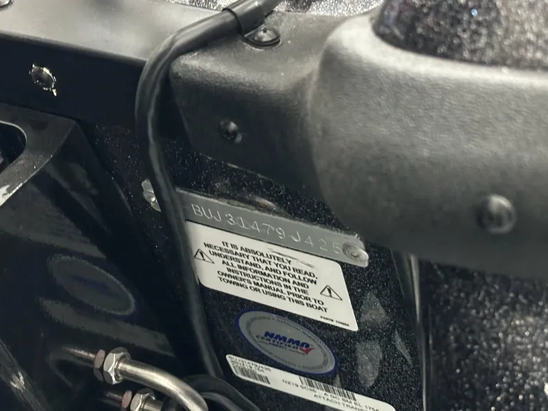 Slide: The Image of Close-up of a 2025 Nitro Z19 boat's identification plate and warning labels. - 24