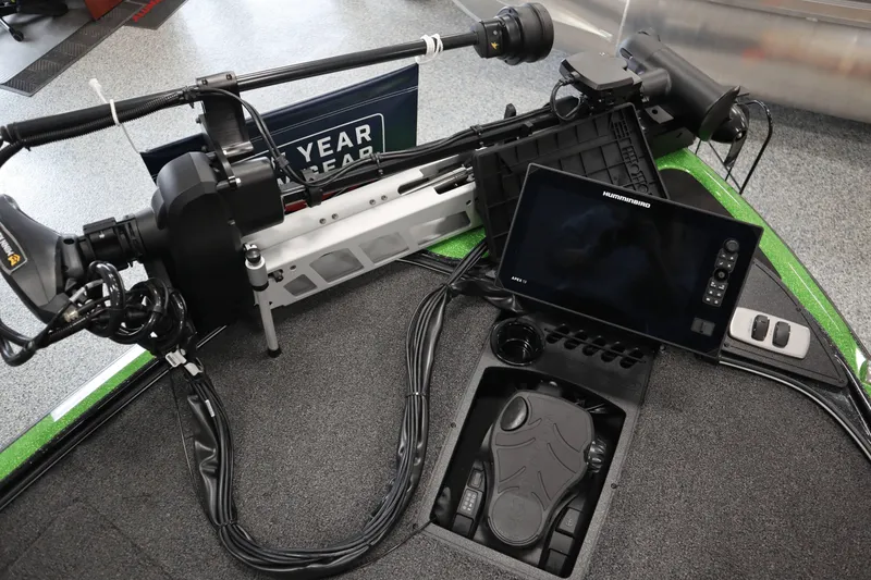 Slide: The Image of 2025 Nitro Z19 boat with green accents displayed indoors at a marine sports store. - 4