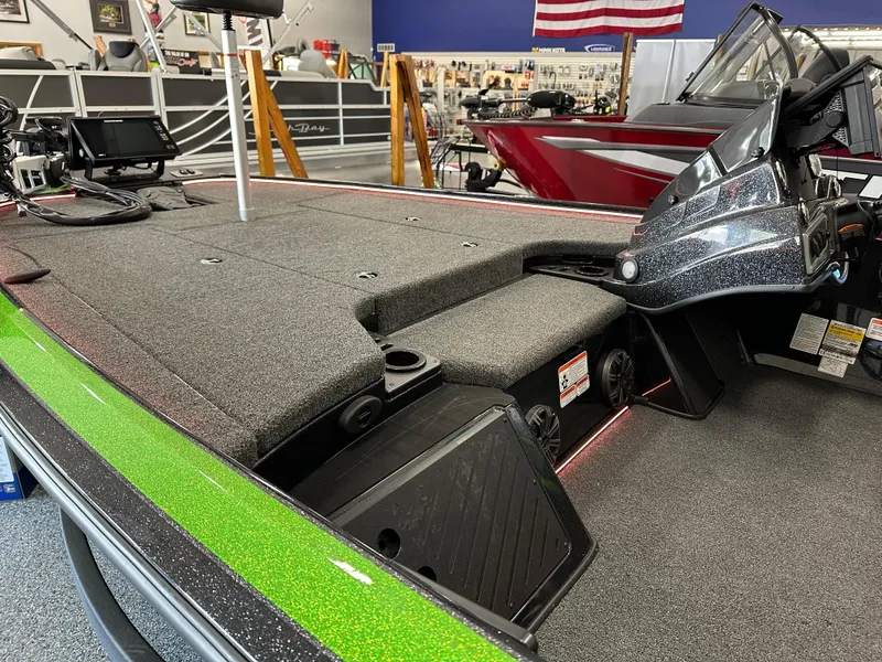 Slide: The Image of 2025 Nitro Z19 boat with Humminbird fish finder and trolling motor in a showroom. - 6