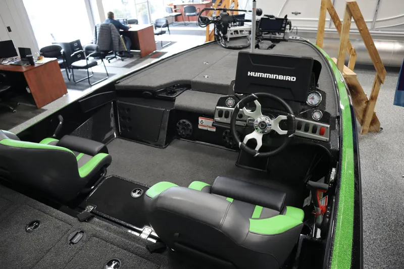 Slide: The Image of 2025 Nitro Z19 boat interior with fishing deck and equipment in showroom. - 9