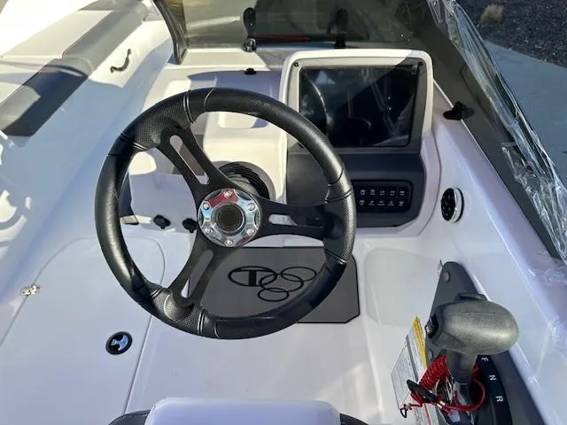 Slide: The Image of 2025 Tahoe T21 boat cockpit with steering wheel and control panel. - 10
