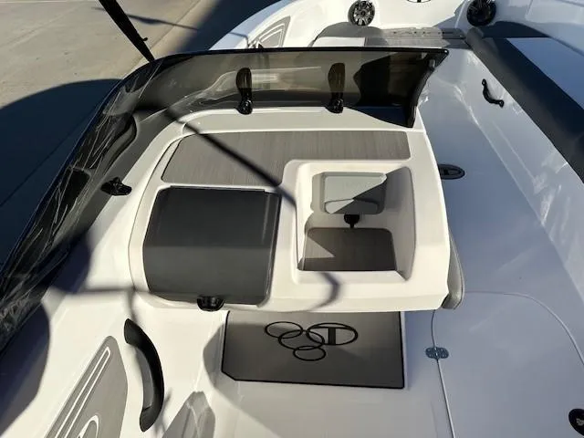 Slide: The Image of 2025 Tahoe T21 boat interior with seating and storage compartments. - 12