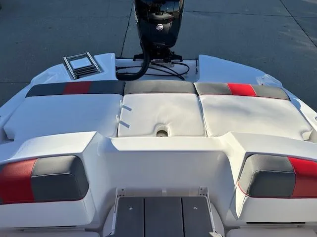 Slide: The Image of 2025 Tahoe T21 boat with cushioned seating and motor, rear view. - 16