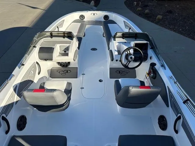 Slide: The Image of 2025 Tahoe T21 boat interior with modern seating and steering console. - 17