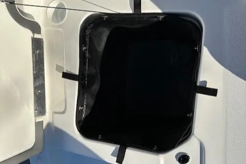 Slide: The Image of Open storage compartment on 2025 Tahoe T21 boat. - 21