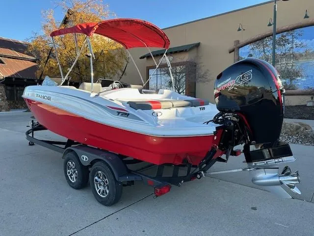 Slide: The Image of 2025 Tahoe T21 boat with red canopy and powerful outboard motor on trailer. - 3