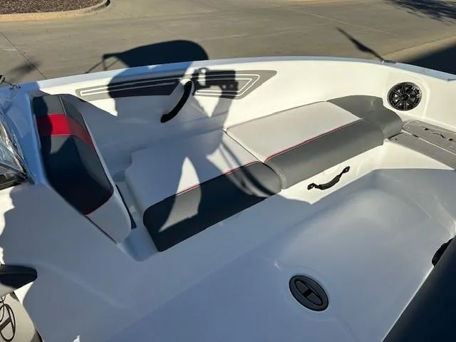 Slide: The Image of 2025 Tahoe T21 boat interior with white and gray seating, black and red accents. - 6