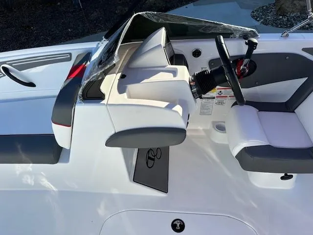Slide: The Image of 2025 Tahoe T21 boat interior with steering wheel and seating. - 9