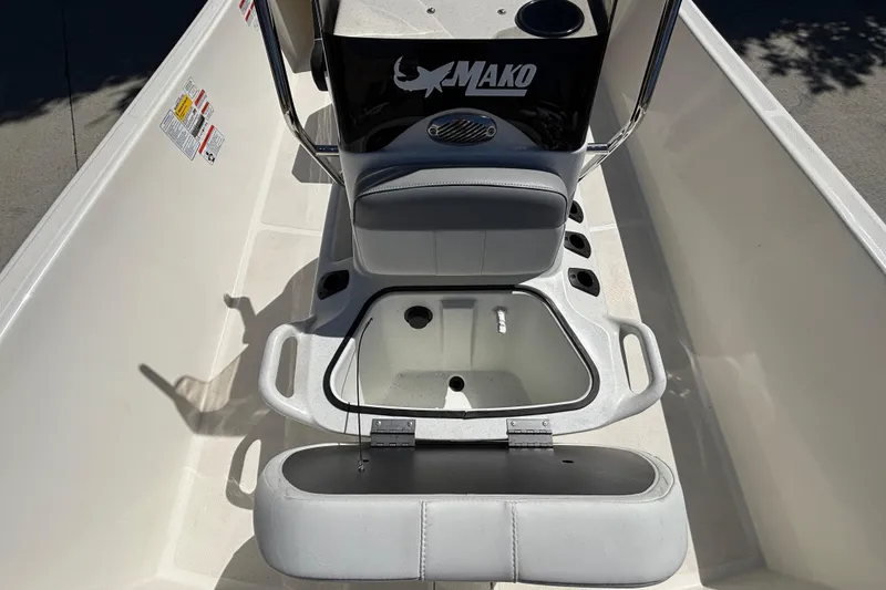 Slide: The Image of 2025 Mako Pro Skiff 17 CC interior view with open storage compartment. - 22
