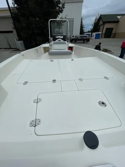 Slide: The Image of 2025 Mako Pro Skiff 17 CC boat with spacious deck and center console. - 8