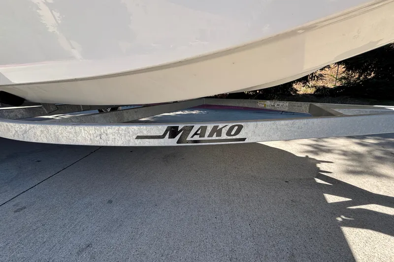 Slide: The Image of 2025 Mako Pro Skiff 17 CC boat on trailer, showcasing brand logo. - 28
