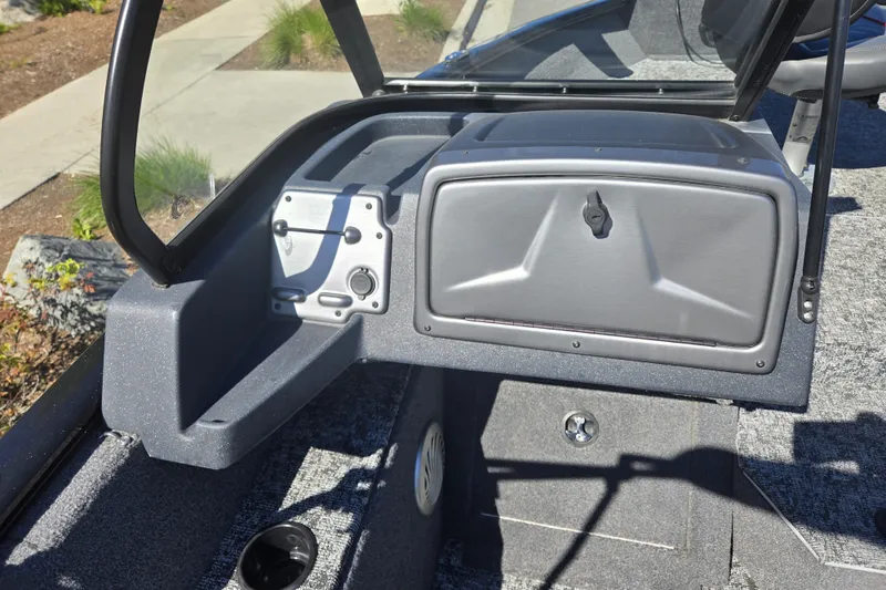 Slide: The Image of 2025 Tracker Pro Guide V-175 WT boat interior with storage compartment and windshield. - 13