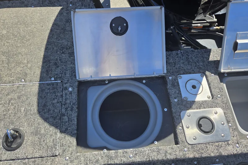 Slide: The Image of 2025 Tracker Pro Guide V-175 WT boat deck with open storage compartment. - 22