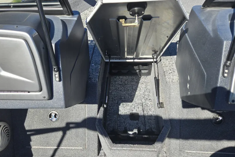 Slide: The Image of Open storage compartment in 2025 Tracker Pro Guide V-175 WT boat interior. - 14