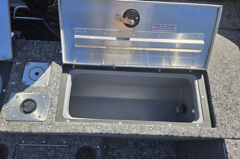 Slide: The Image of Open storage compartment on 2025 Tracker Pro Guide V-175 WT boat deck. - 21