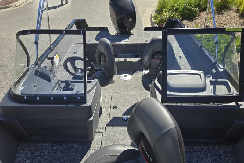 Slide: The Image of 2025 Tracker Pro Guide V-175 WT boat interior with steering wheel and seating. - 19