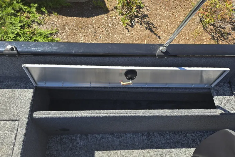 Slide: The Image of 2025 Tracker Pro Guide V-175 WT boat storage compartment with open lid, showing interior space. - 15