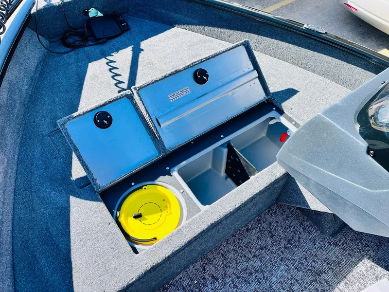 Slide: The Image of 2025 Tracker Pro Guide V-16 SC boat storage compartments with open lids. - 13