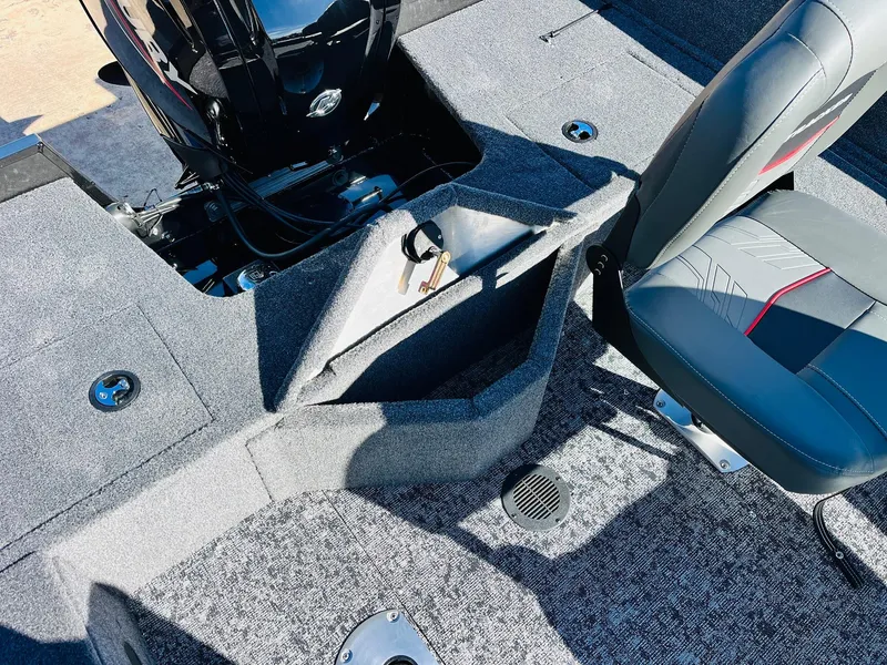 Slide: The Image of 2025 Tracker Pro Guide V-16 SC boat interior with storage compartment and seating. - 24