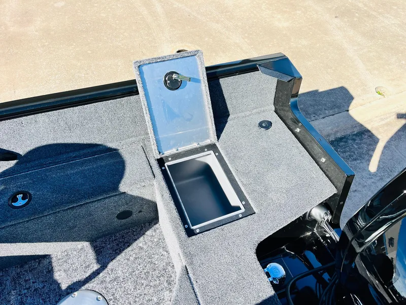 Slide: The Image of 2025 Tracker Pro Guide V-16 SC boat interior with open storage compartment. - 28