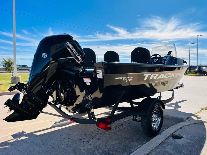 Slide: The Image of 2025 Tracker Pro Guide V-16 SC boat with Mercury engine on trailer. - 4