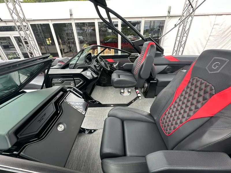 Slide: The Image of Interior of 2024 Godfrey XP 27' Windshield boat, featuring luxurious seating and modern design. - 1