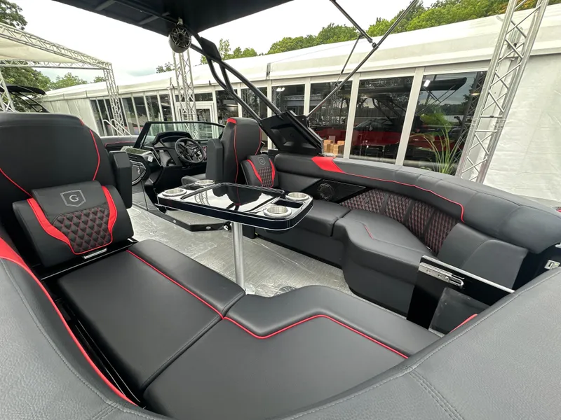 Slide: The Image of Luxurious interior of 2024 Godfrey XP 27' Windshield boat with sleek seating and modern design. - 2