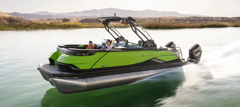 Slide: The Image of 2024 Godfrey XP 27' boat with twin 400HP engines cruising on a scenic river. - 9