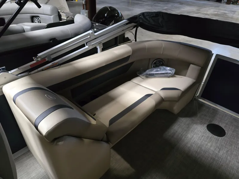 Slide: The Image of 2025 Premier 220 Sunscape RF boat interior with beige seating and modern design. - 11