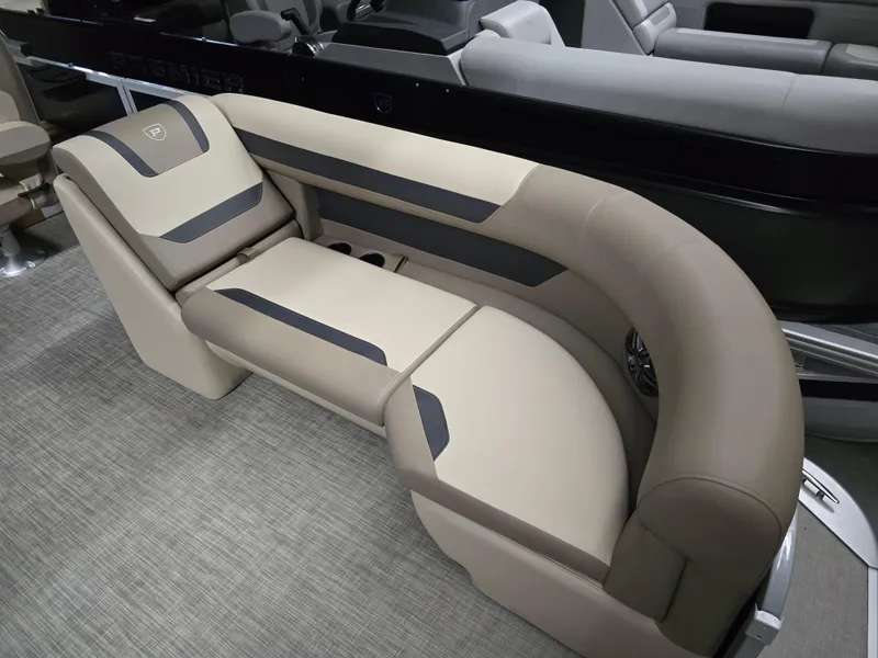 Slide: The Image of Luxurious seating in 2025 Premier 220 Sunscape RF boat, featuring beige and gray upholstery. - 4