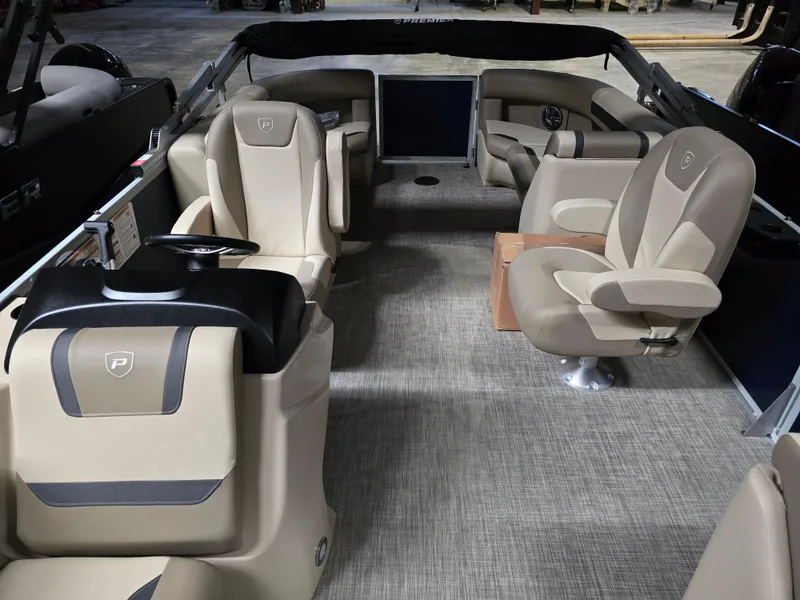 Slide: The Image of 2025 Premier 220 Sunscape RF boat interior with beige seating and modern design. - 6