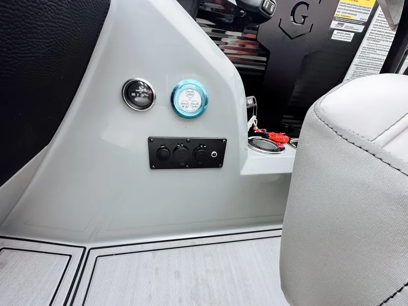 Slide: The Image of Control panel of 2025 Godfrey Monaco 23' Dual Flip Lounge Tritoon boat interior. - 13