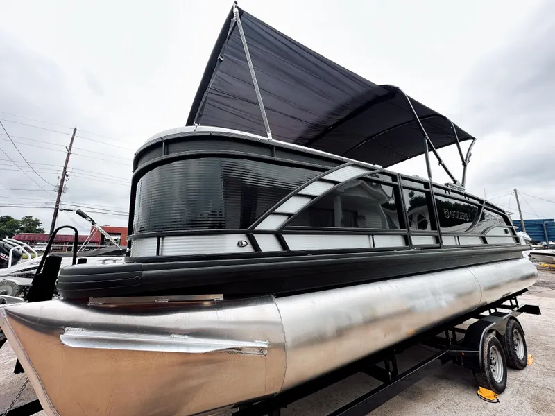 Slide: The Image of 2025 Godfrey Monaco 23' Dual Flip Lounge Tritoon with canopy on trailer. - 18