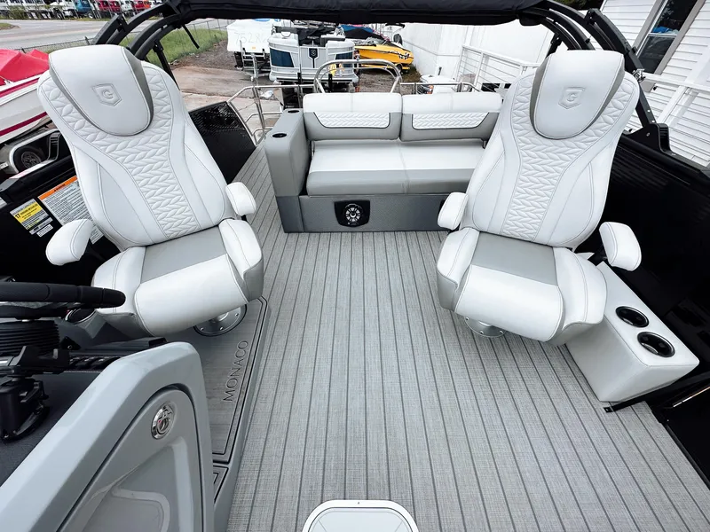 Slide: The Image of Luxurious interior of 2025 Godfrey Monaco 23' Dual Flip Lounge Tritoon with plush seating. - 6