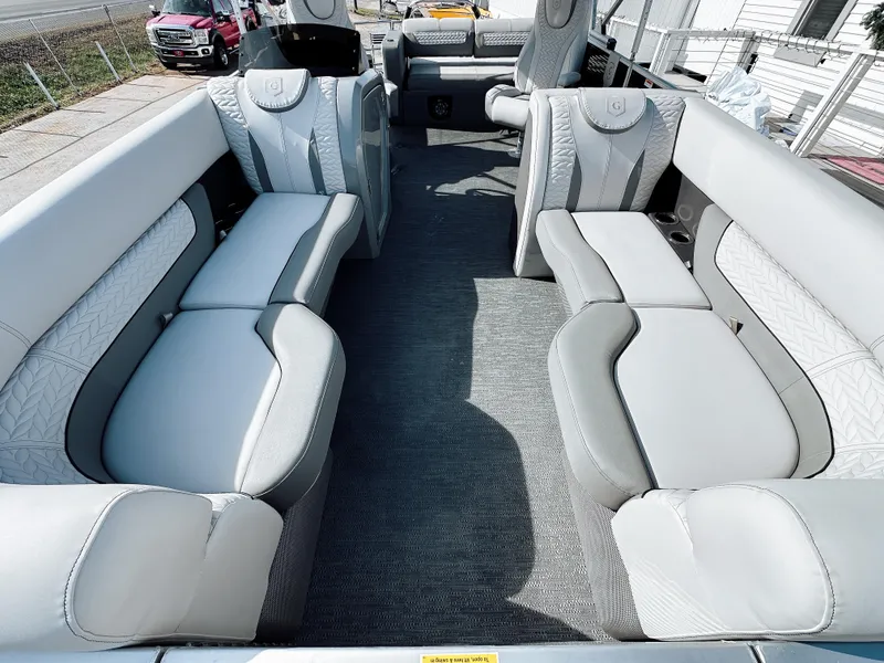 Slide: The Image of 2025 Godfrey Monaco 23' Tritoon with luxurious dual flip lounge seating. - 3