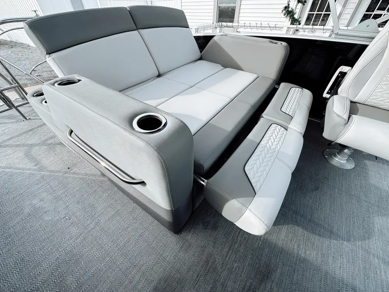 Slide: The Image of 2025 Godfrey Monaco Tritoon with dual flip lounge seating and cup holders. - 7
