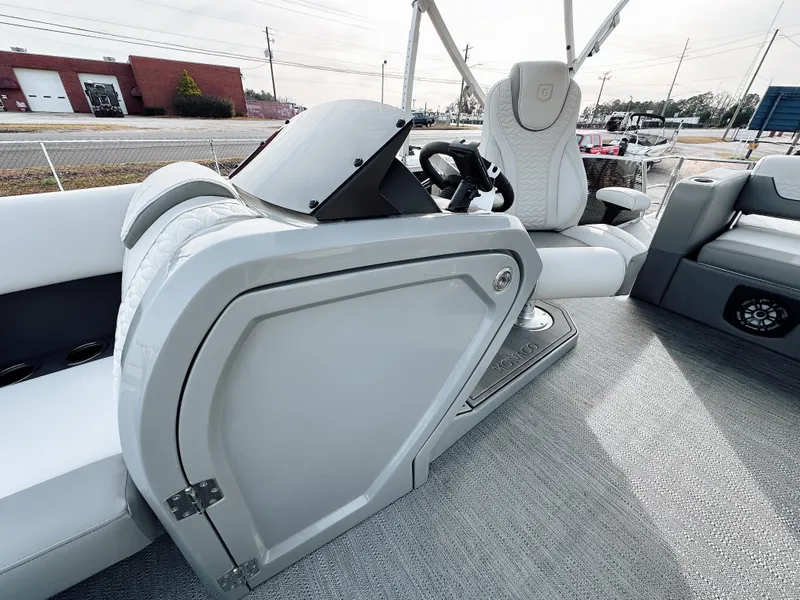 Slide: The Image of Interior of 2025 Godfrey Monaco 23' Tritoon, featuring sleek helm and comfortable seating. - 8