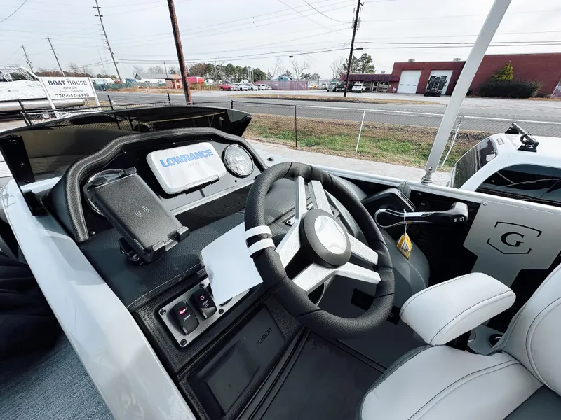 Slide: The Image of 2025 Godfrey Monaco Tritoon dashboard with steering wheel and controls. - 9