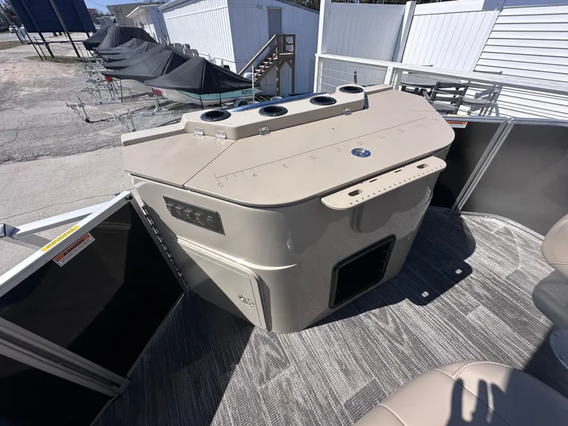 Slide: The Image of 2024 Godfrey Sweetwater 22' Tritoon interior with fishing station and seating area. - 10