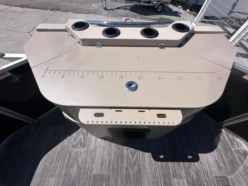 Slide: The Image of 2024 Godfrey Sweetwater 22' Tritoon fishing station with cup holders and measuring guide. - 11