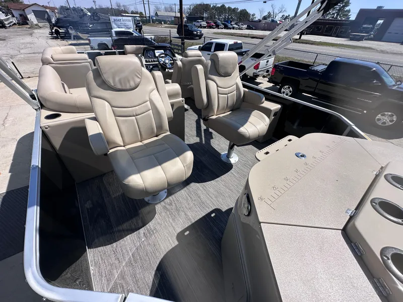 Slide: The Image of 2024 Godfrey Sweetwater 22' Tritoon with plush seating and spacious deck layout. - 4