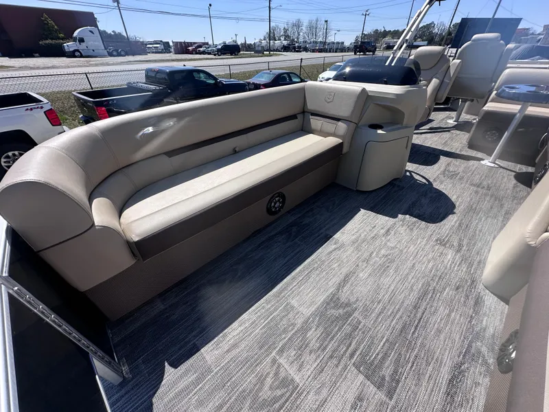 Slide: The Image of 2024 Godfrey Sweetwater 22' Tritoon interior with plush seating and modern design. - 5