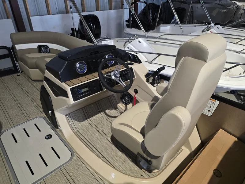 Slide: The Image of 2025 Premier 230 SunSation RF boat interior with modern helm and seating. - 11