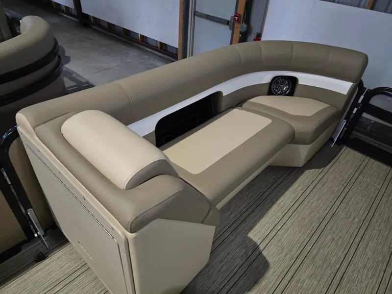 Slide: The Image of 2025 Premier 230 SunSation RF boat interior with beige seating and modern design. - 15