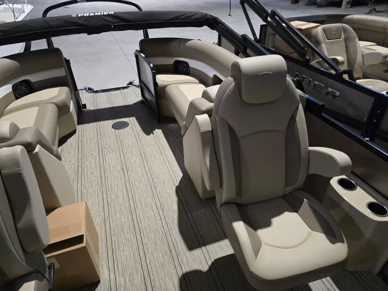 Slide: The Image of 2025 Premier 230 SunSation RF boat interior with beige seating and modern design. - 18