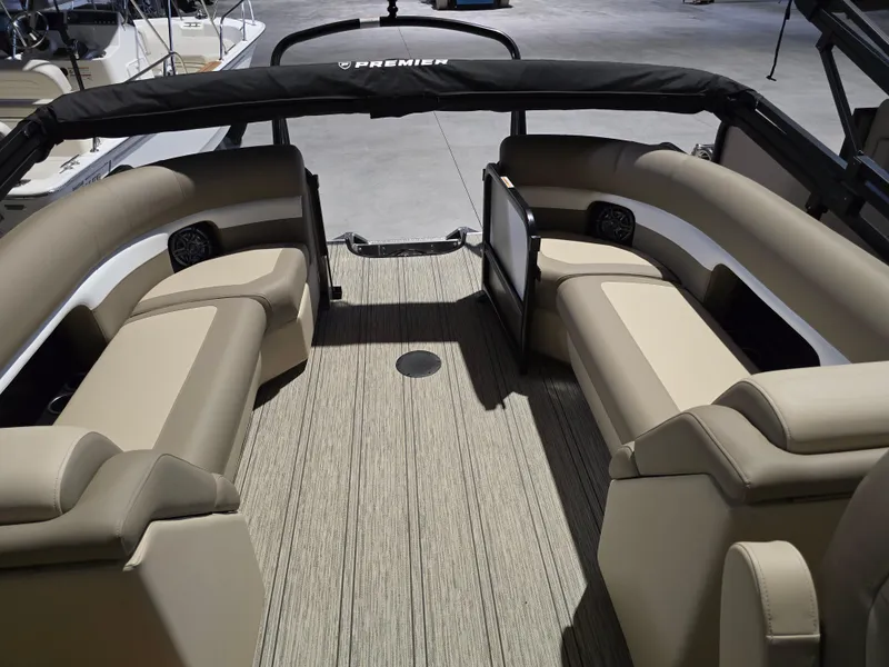 Slide: The Image of 2025 Premier 230 SunSation RF boat interior with beige seating and modern design. - 19