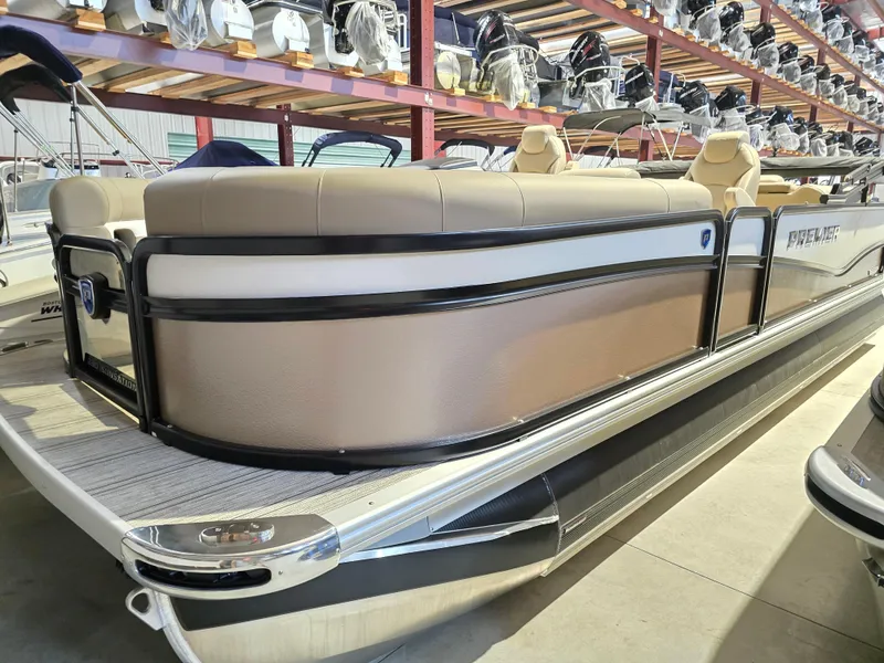 Slide: The Image of 2025 Premier 230 SunSation RF boat interior with beige seating and wood-style flooring. - 20