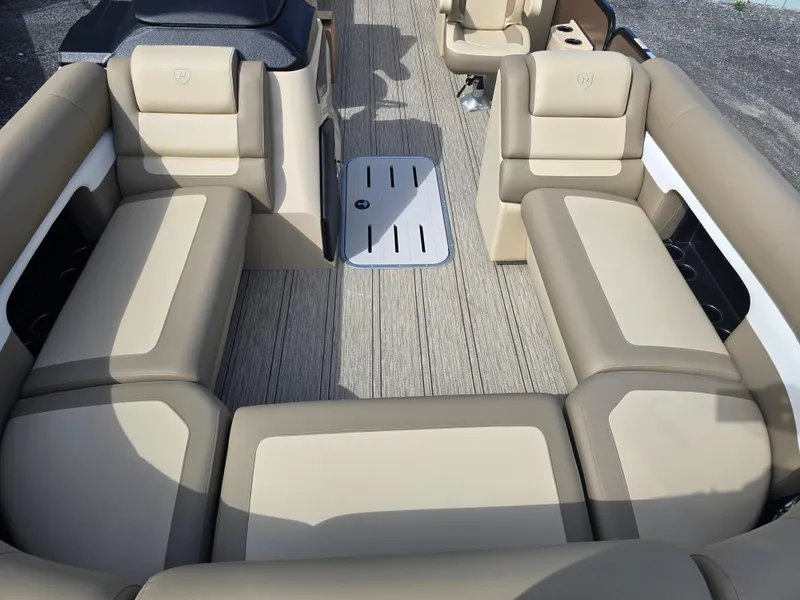Slide: The Image of Luxurious interior of 2025 Premier 230 SunSation RF pontoon boat with beige seating. - 22