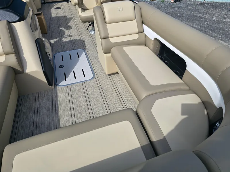 Slide: The Image of Luxurious seating on 2025 Premier 230 SunSation RF pontoon boat, featuring beige upholstery. - 24